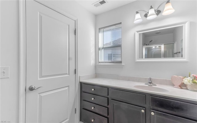 bathroom with vanity and walk in shower