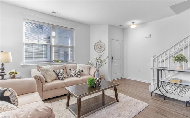 living room with light hardwood / wood-style flooring