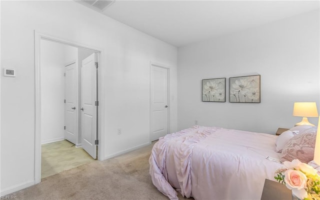 carpeted bedroom featuring a closet