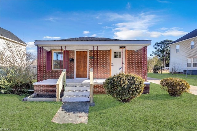 bungalow-style home with a porch and a front yard