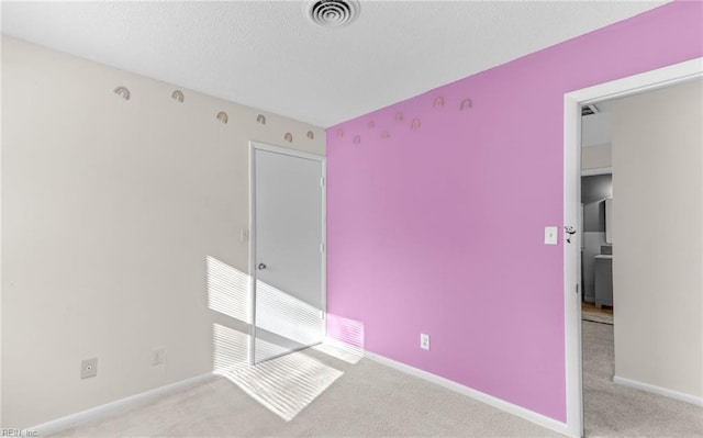 unfurnished bedroom with light carpet