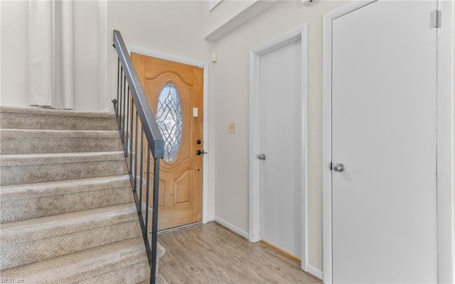 entryway with light hardwood / wood-style flooring