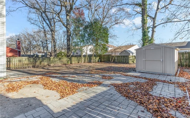 view of yard with a patio and a shed