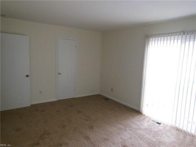 empty room featuring carpet