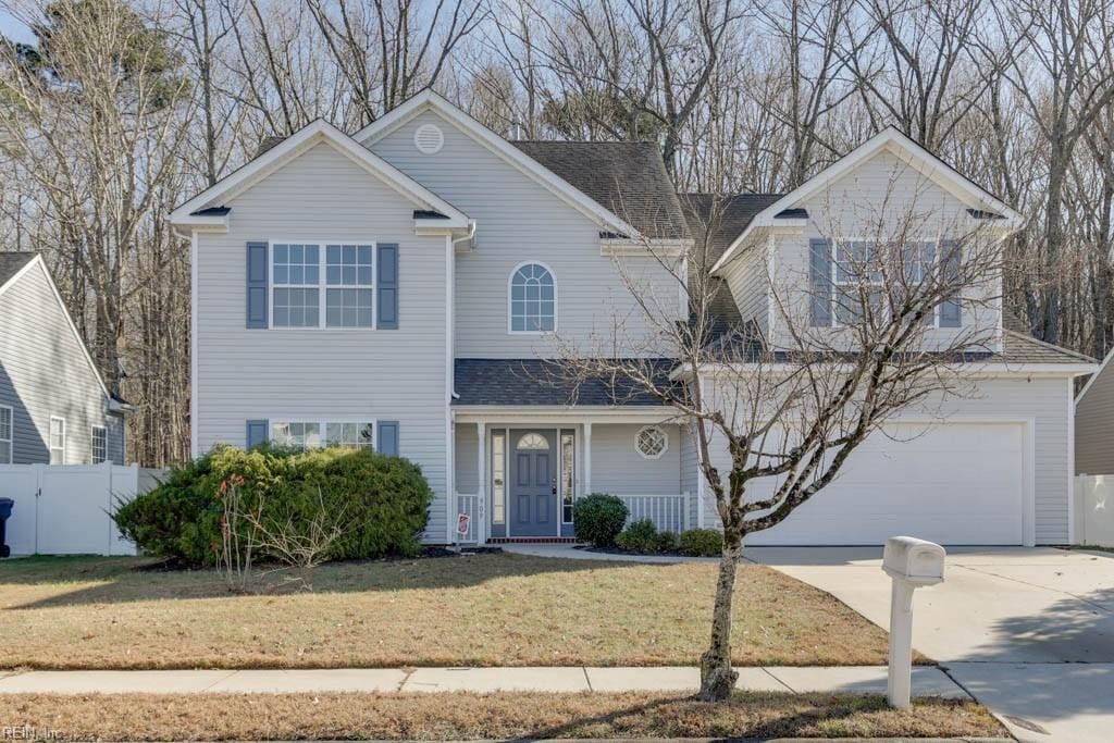 view of front property with a garage and a front yard