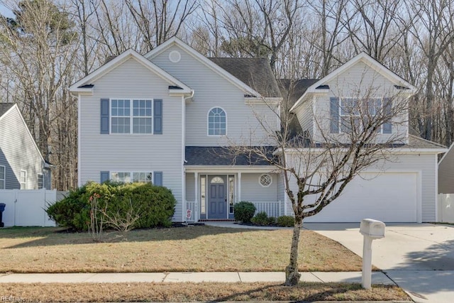 view of front property with a garage and a front yard