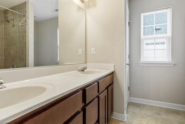 bathroom featuring vanity and a wealth of natural light