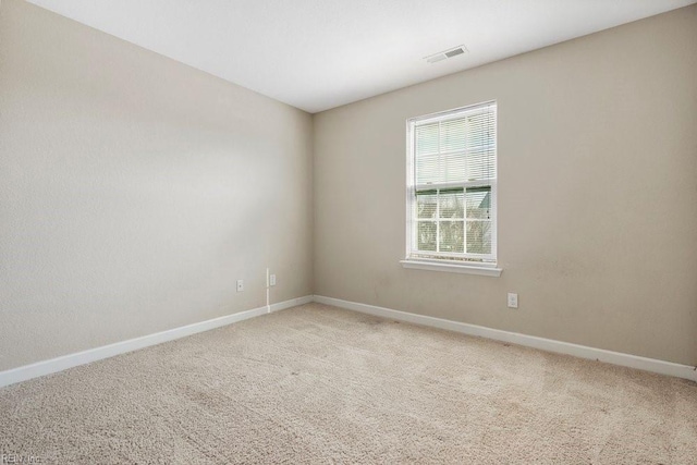 empty room with carpet flooring