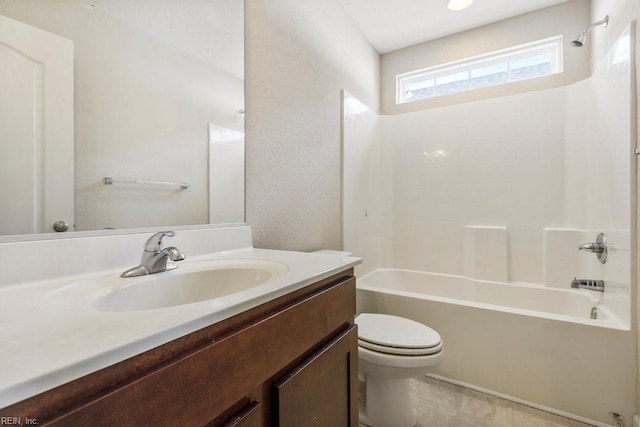 full bathroom with toilet, vanity, and tub / shower combination