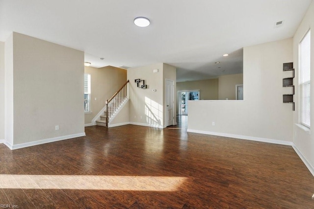 unfurnished room featuring dark hardwood / wood-style flooring