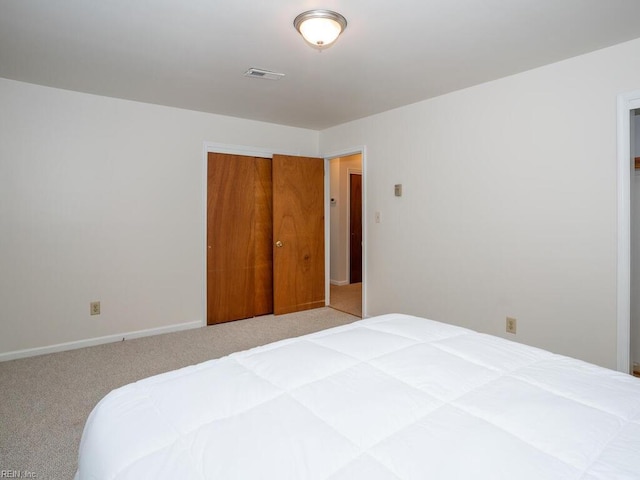 carpeted bedroom featuring a closet