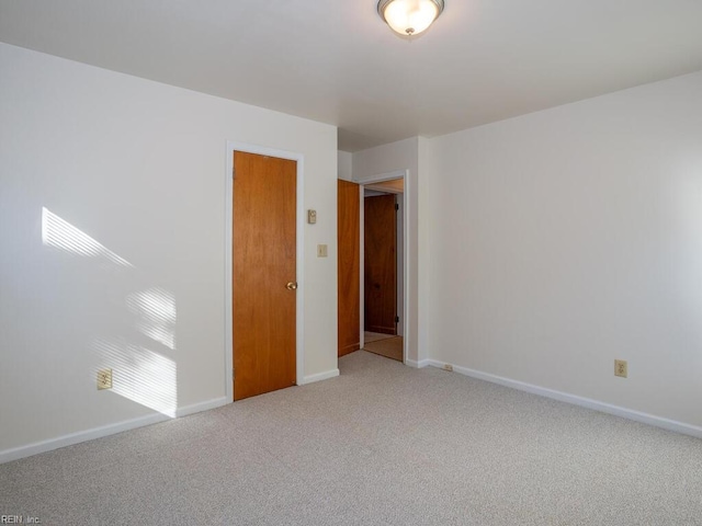 empty room with carpet flooring