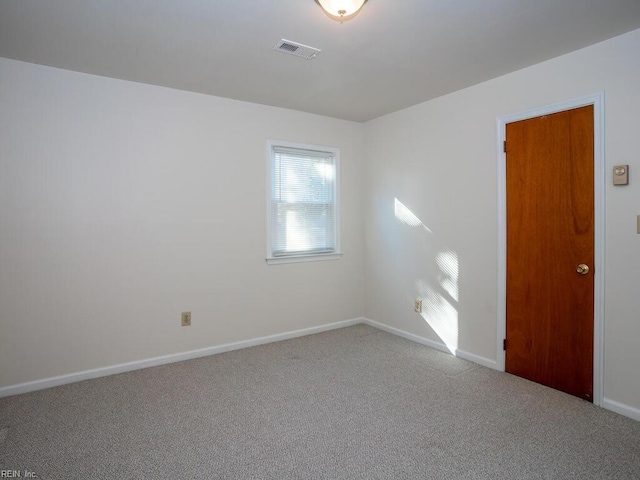 spare room featuring carpet