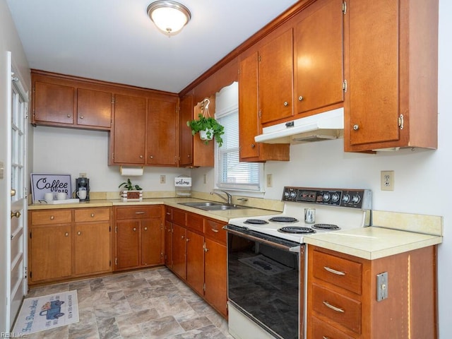 kitchen featuring white electric range and sink