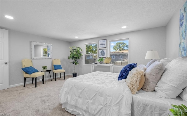 carpeted bedroom featuring a textured ceiling