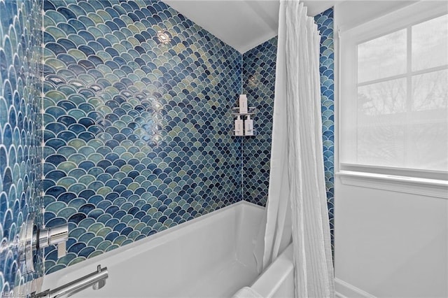 bathroom featuring shower / tub combo with curtain