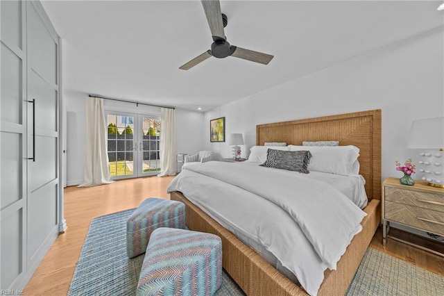 bedroom featuring access to exterior, ceiling fan, french doors, and light wood-type flooring