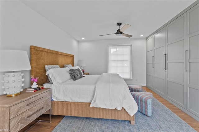 bedroom featuring ceiling fan and light wood-type flooring