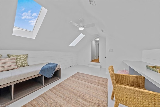 bonus room featuring ceiling fan and vaulted ceiling with skylight