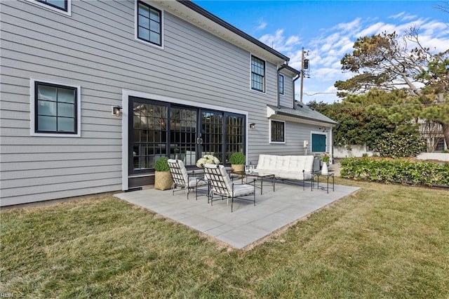 back of house featuring an outdoor hangout area, a patio area, and a lawn