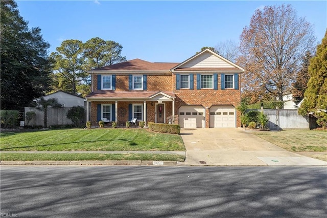 view of front of house with a front lawn and a garage