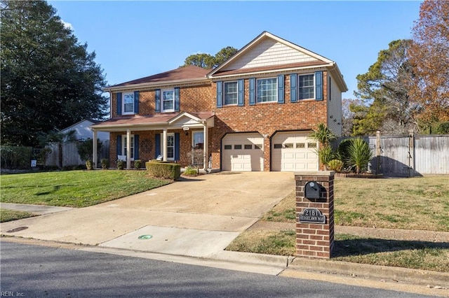 view of front facade with a garage and a front lawn