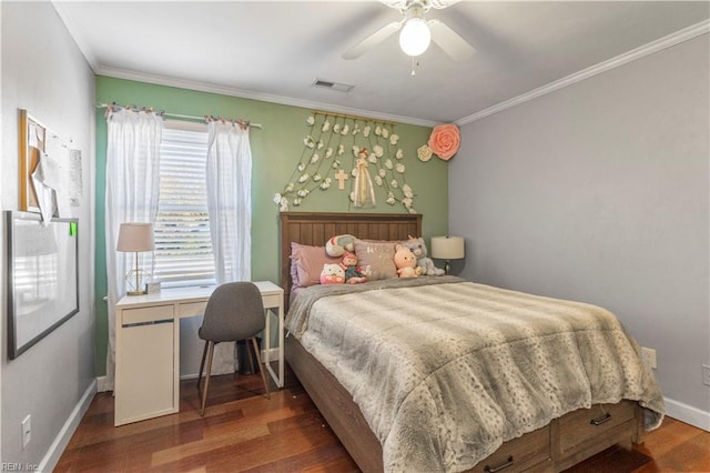 bedroom featuring dark hardwood / wood-style flooring, ceiling fan, and crown molding