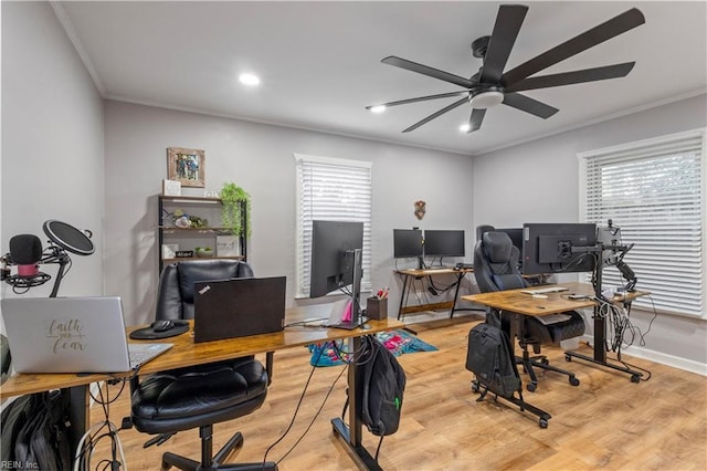 home office featuring ceiling fan, light hardwood / wood-style floors, and crown molding