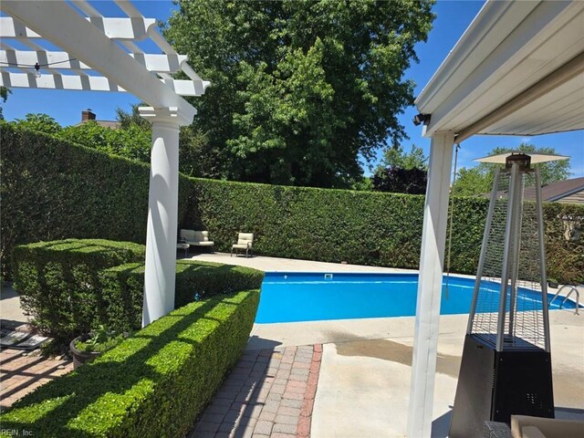 view of pool with a pergola and a patio area