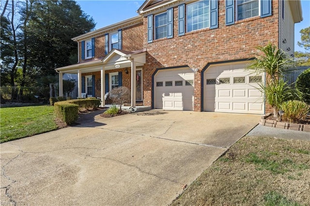 view of front of home with a garage and a front lawn