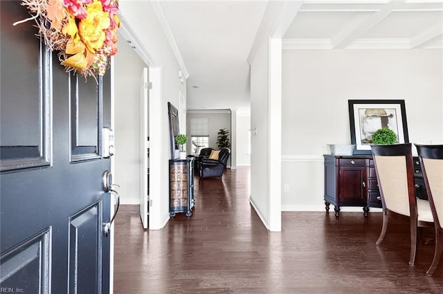 entryway with beam ceiling, dark hardwood / wood-style flooring, ornamental molding, and coffered ceiling