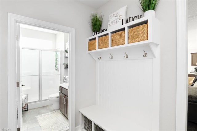 mudroom featuring light tile patterned flooring