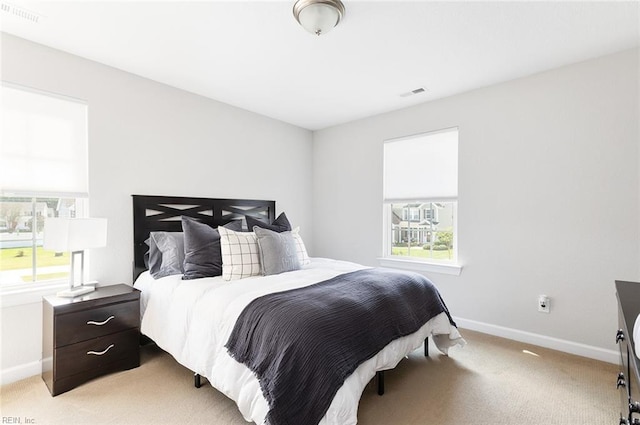 bedroom with light carpet