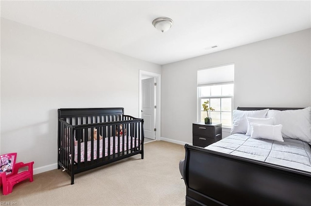 bedroom featuring light carpet