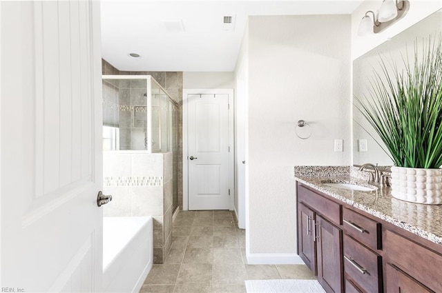 bathroom with separate shower and tub and vanity