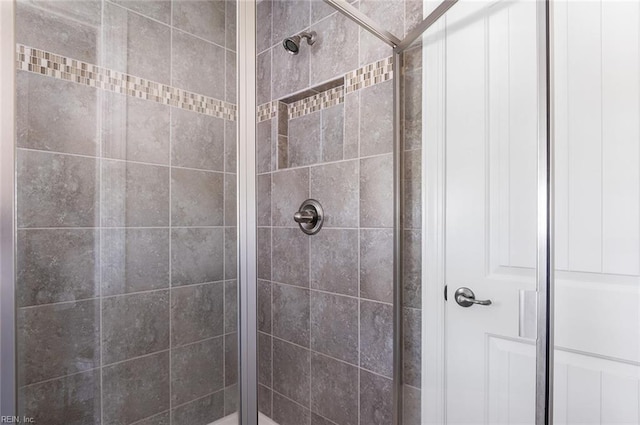 bathroom with a tile shower