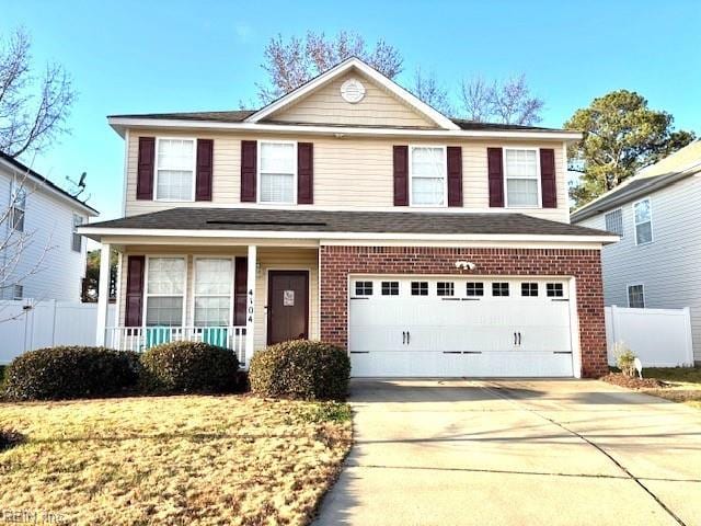 front facade featuring a garage and a front yard