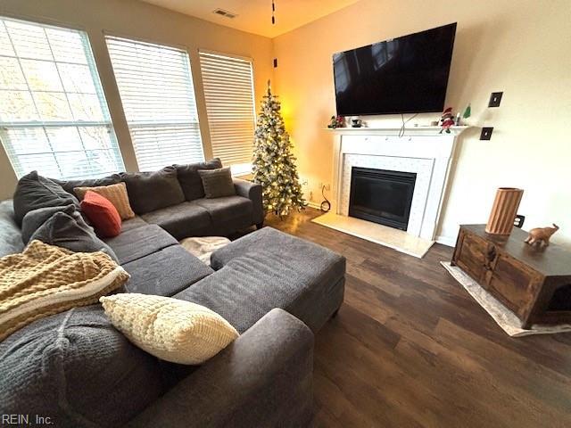 living room featuring dark wood-type flooring