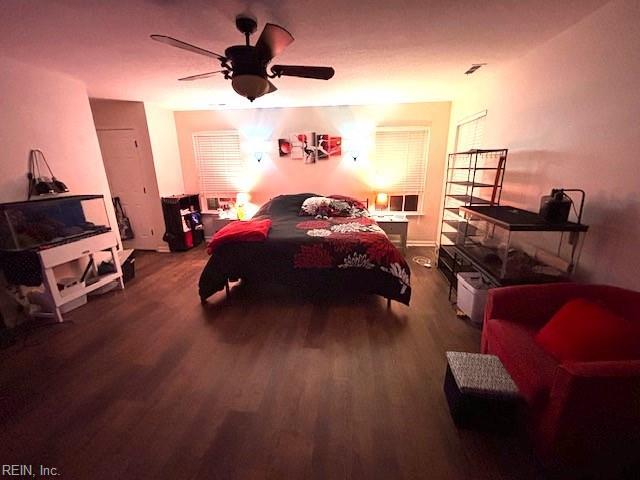 bedroom with ceiling fan and wood-type flooring