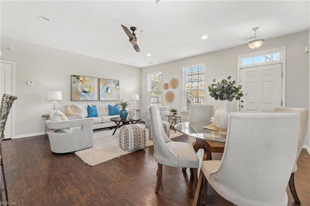 dining space with dark hardwood / wood-style floors and ceiling fan