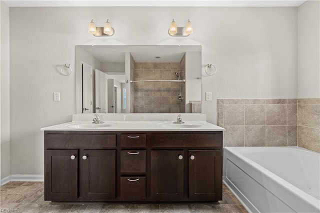 bathroom featuring vanity and shower with separate bathtub