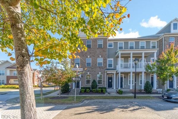 multi unit property featuring a balcony