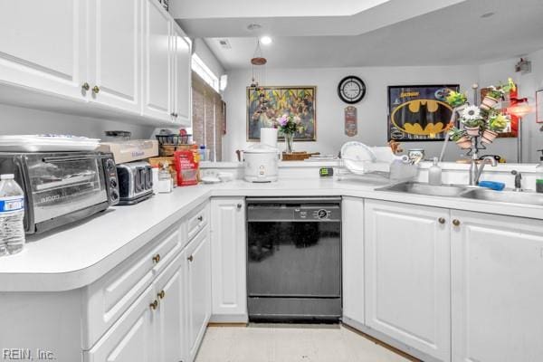 kitchen with sink, black dishwasher, kitchen peninsula, decorative light fixtures, and white cabinets