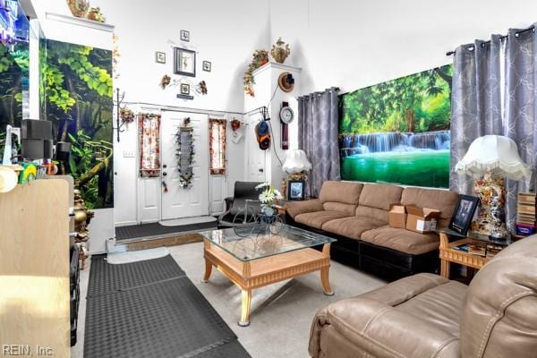 living room with a high ceiling