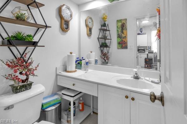 bathroom with vanity and toilet