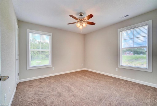 spare room with carpet and ceiling fan