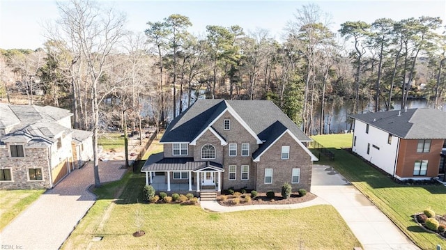 view of front of home featuring a front yard and covered porch