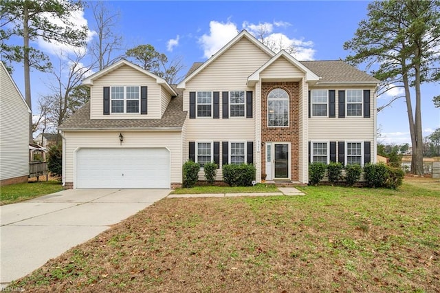 colonial home with a front yard and a garage