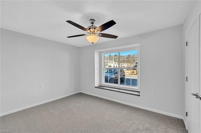 unfurnished room featuring carpet flooring and ceiling fan