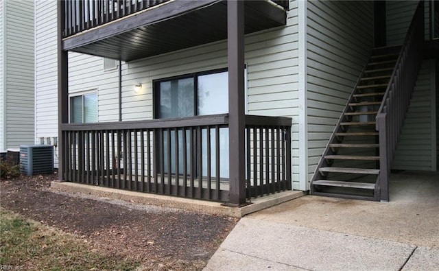 doorway to property featuring central air condition unit